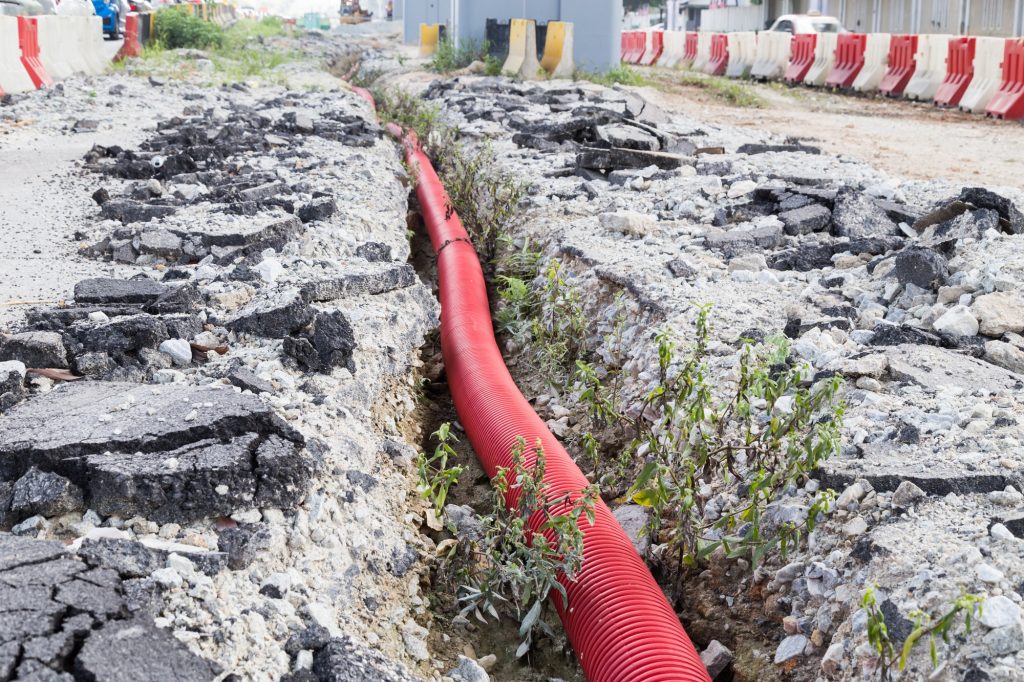 Underground trench with sewage piping at infrastructure construc